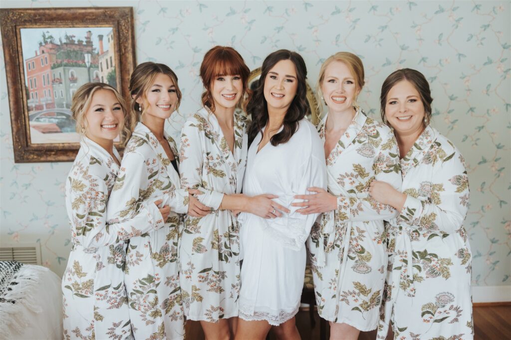 bride portrait getting ready with bridesmaids in pjs