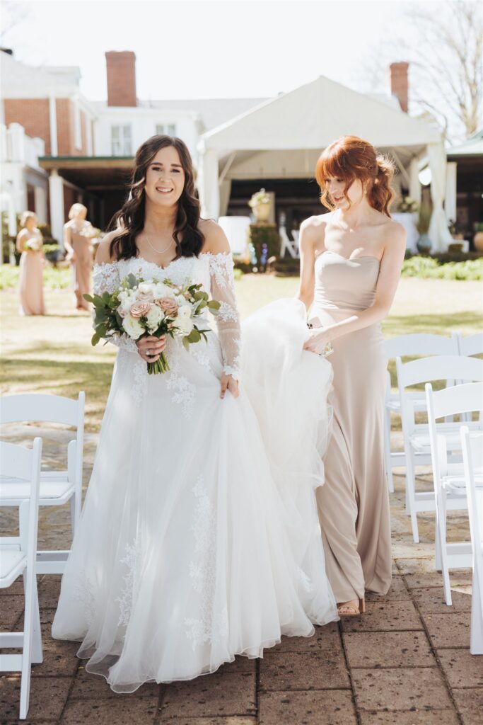 bride walking with maid of honor
