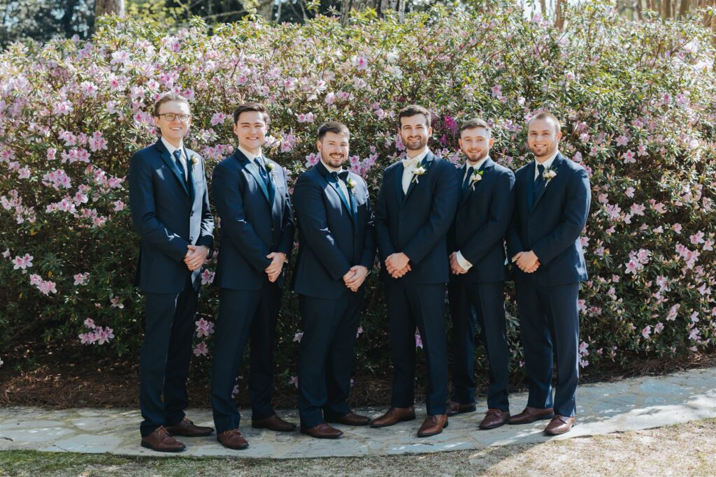 groomsmen and groom portrait with blue suits
