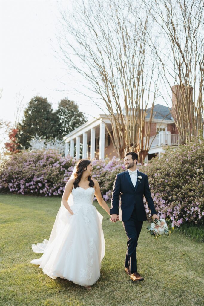 bride and groom walking in garden