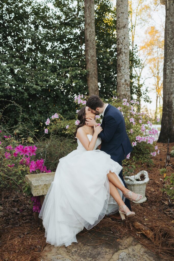bride and groom kissing in garden birmingham alabama