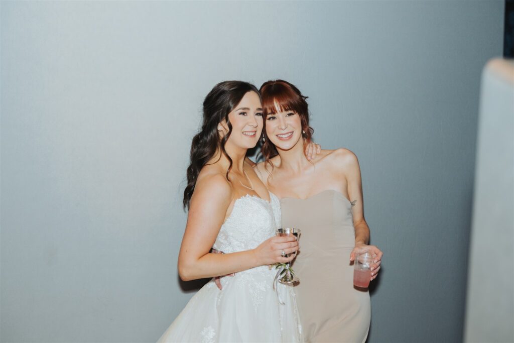 bride posing with maid of honor