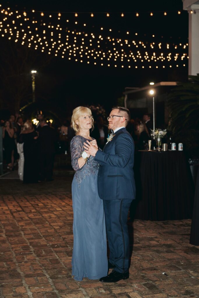mother and groom dancing at wedding reception