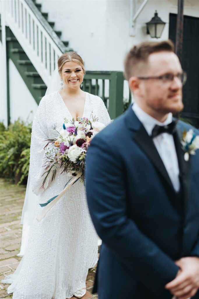 bride and groom first look downtown mobile wedding at the Ezell House 