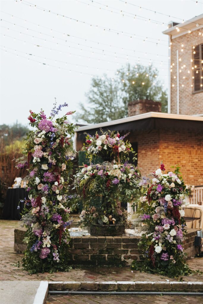 wedding decor with greenery and purple flowers at the Ezell House in Downtown Mobile Alabama