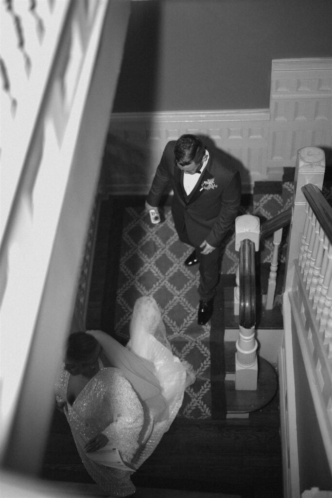 bride and groom walking upstairs at the Ezell House in Downtown Mobile Alabama