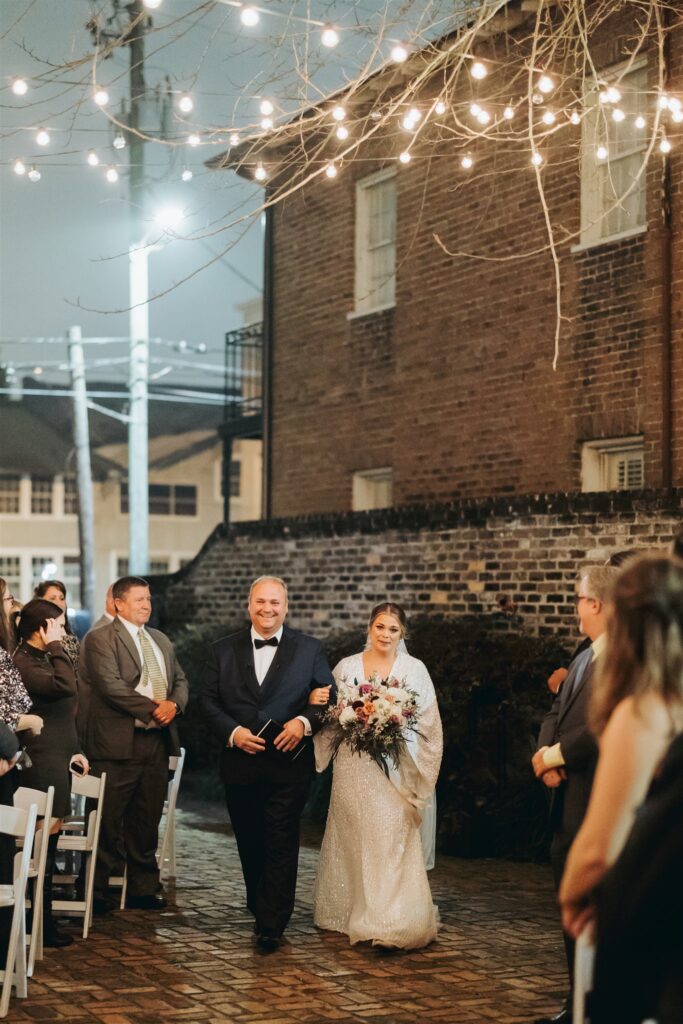 bride and father walking down the aisle wedding ceremony in downtown mobile alabama at the Ezell House 