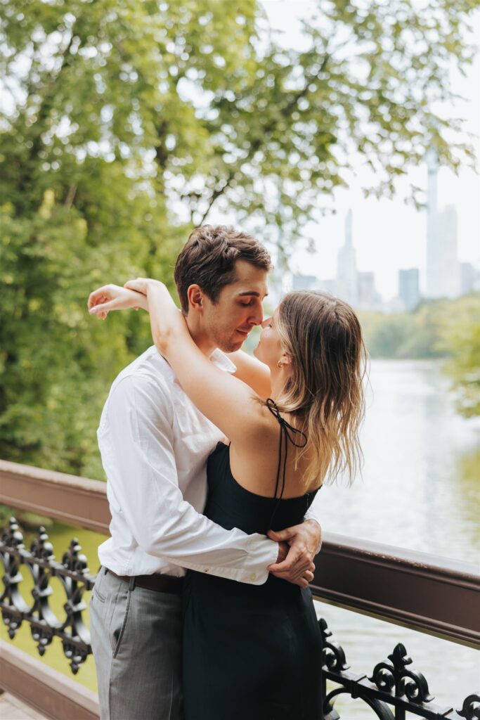engaged couple hugging at central park in new york city