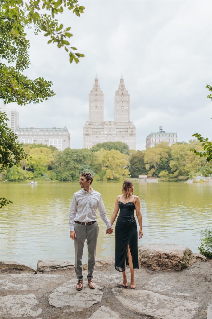 engaged couple standing at central park in new york city