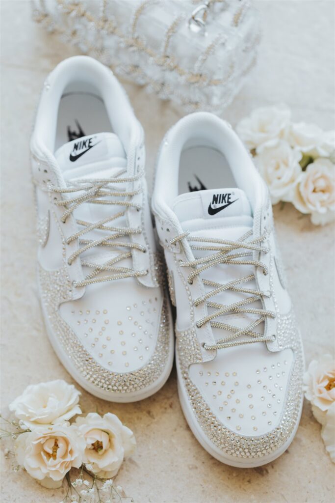 White and light pink wedding details with nike shoes for los cabos luxury wedding