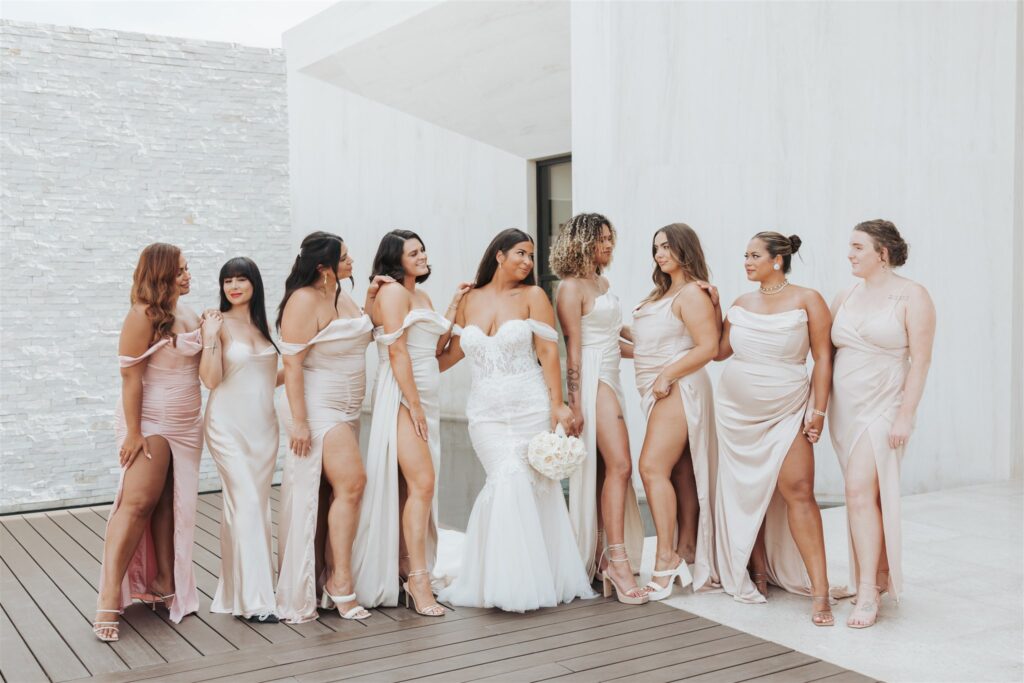 bride and bridesmaids in light pink dresses