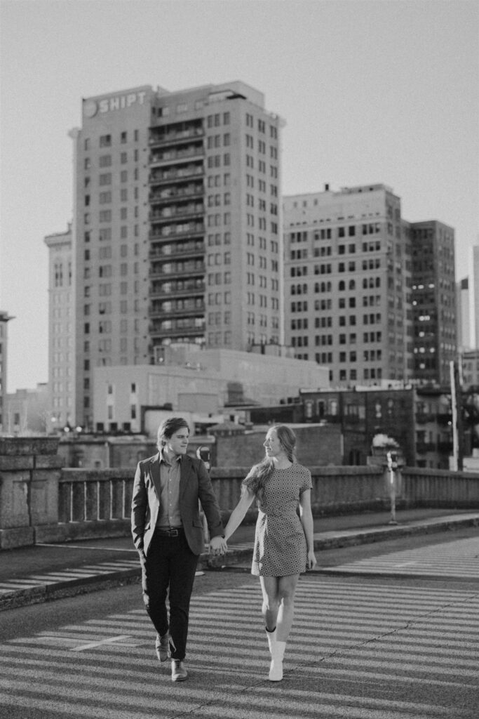 couple walking in the street at sunset