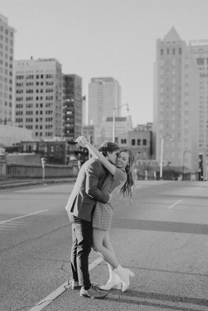 couple hugging in the street at sunset in Birmingham, Alabama