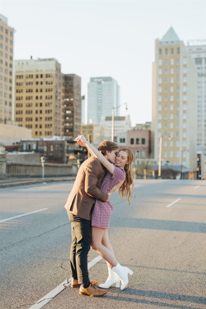 couple hugging in the street at sunset in Birmingham, Alabama