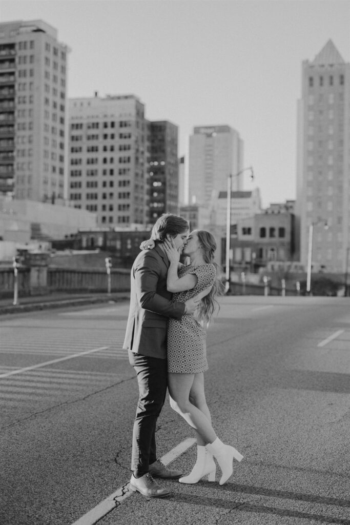 couple hugging in the street at sunset