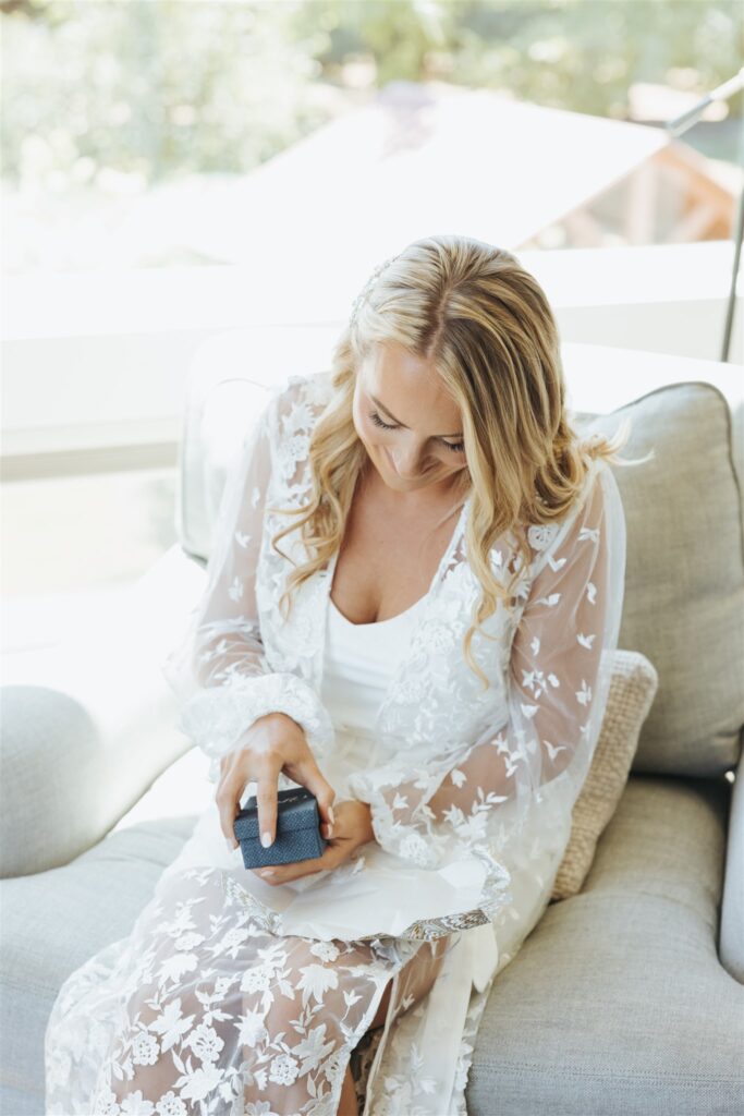 bride getting ready for the wedding in lace pjs