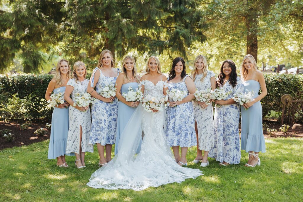 bride portrait with bridesmaids in floral dresses