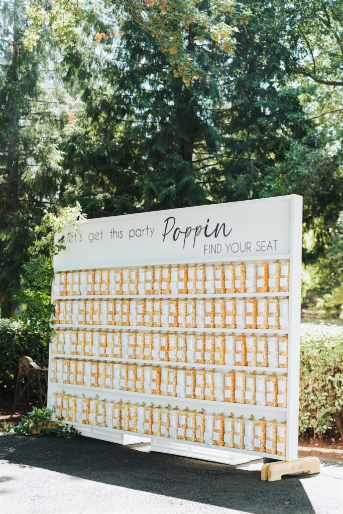 popcorn seating chart at garden party wedding