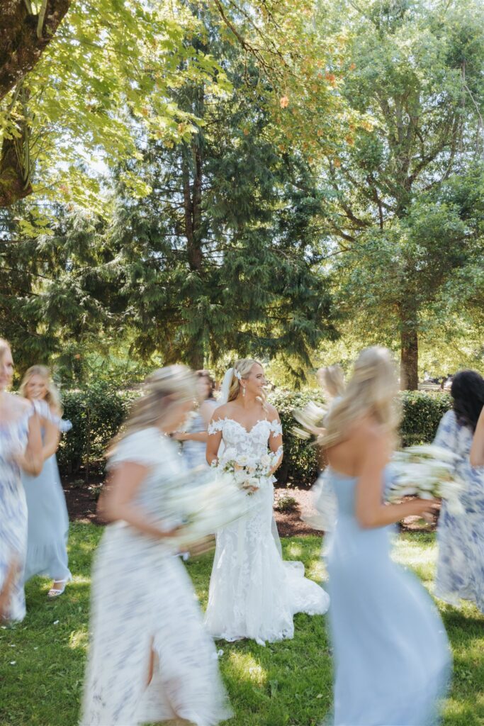 bride with bridesmaids running around her