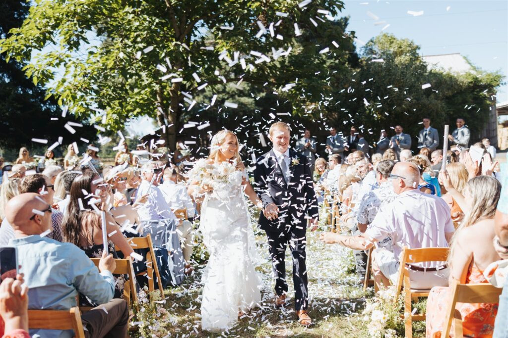 bride and groom wedding ceremony exit with confetti