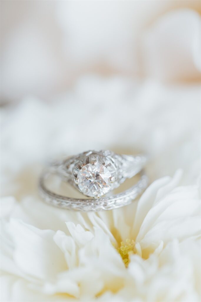 wedding rings on white flower