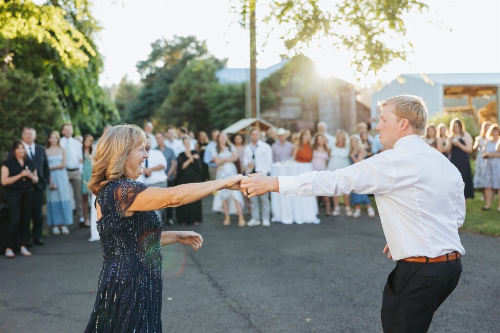 mother and groom first dance at garden party wedding