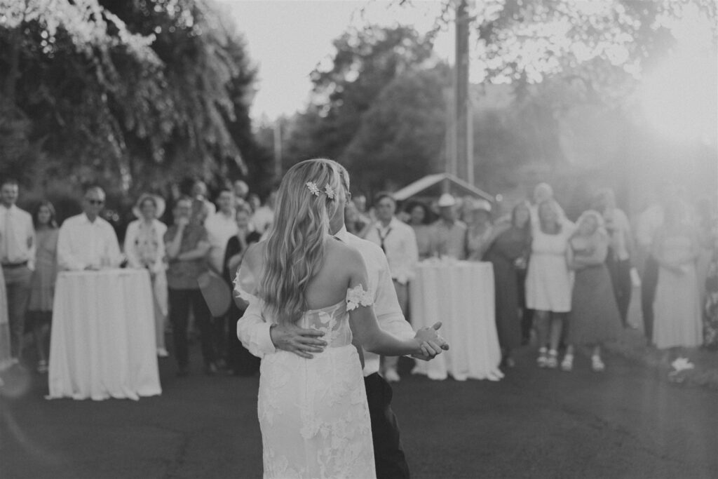 bride and groom first dance at garden party wedding
